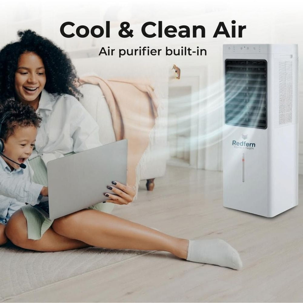 Woman and child using a laptop with a Redfern air cooler in the background