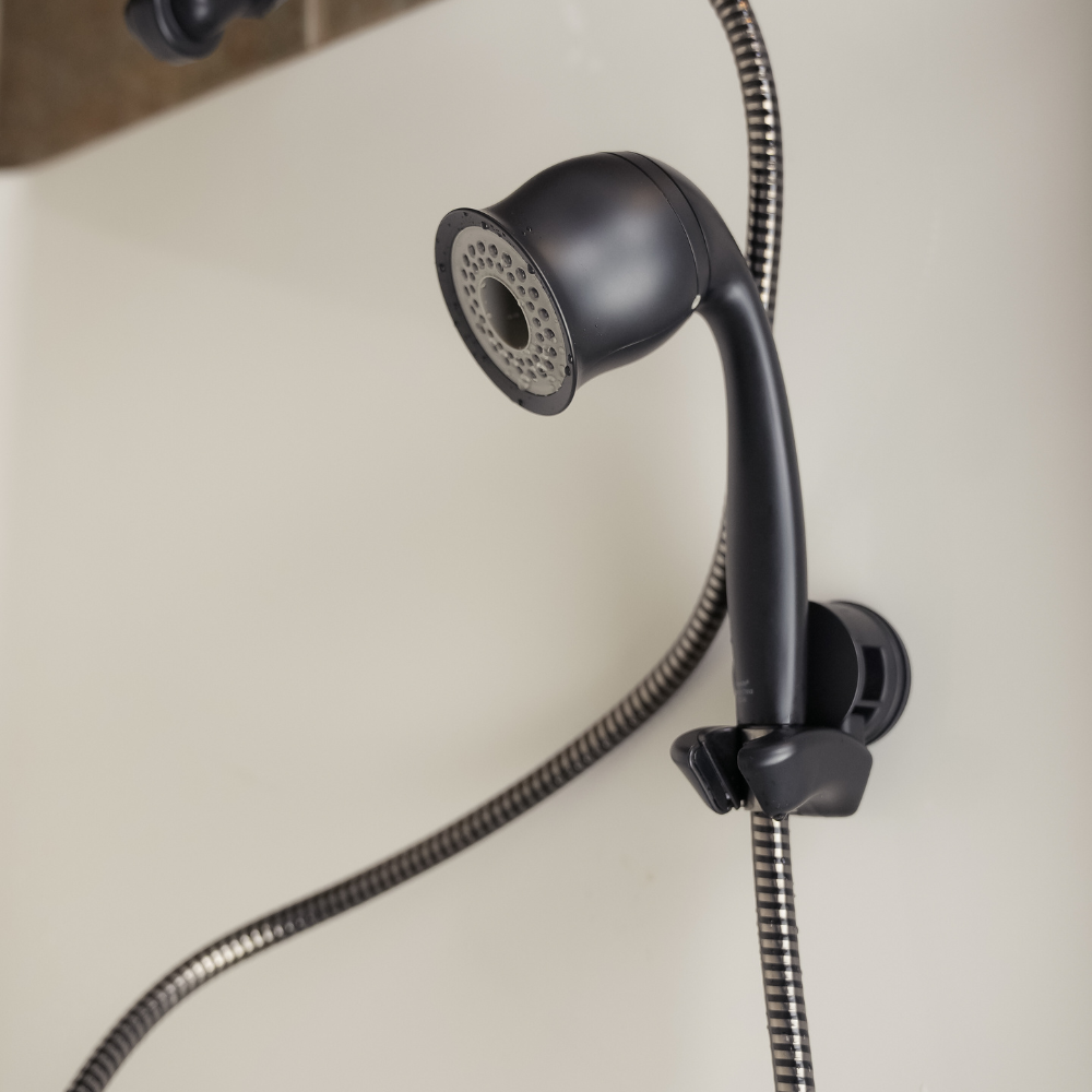 ShowerMe® Handheld Showerhead Matte Black mounted on shower wall.