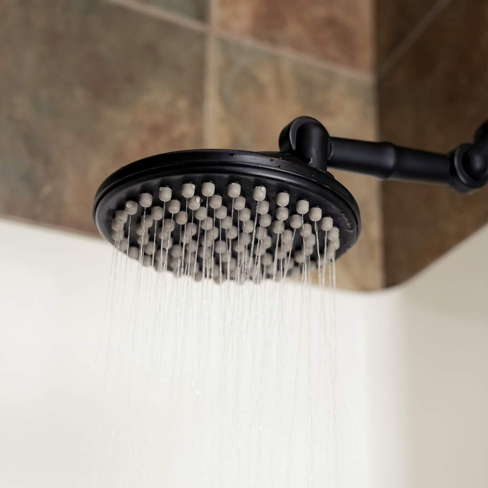 ShowerMe® Shower Head in Matte Black with water running