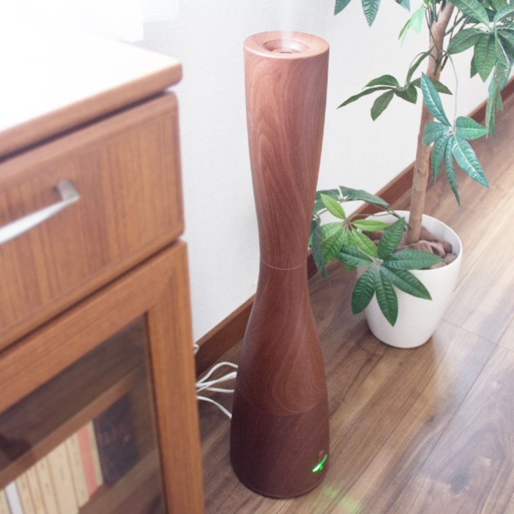 Micro Mist Tower Humidifier and Essential Oil Diffuser placed on the ground.