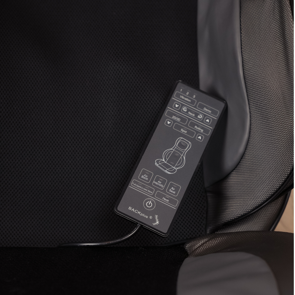 Close up of BACKplus® Shiatsu Neck and Back Massager With Air Compression Chair Cushion remote