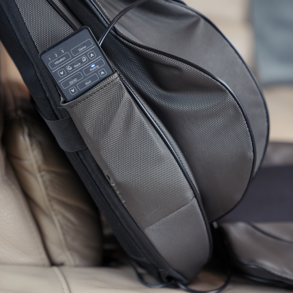 Close up of remote and pocket of BACKplus® Shiatsu Neck and Back Massager With Air Compression Chair Cushion