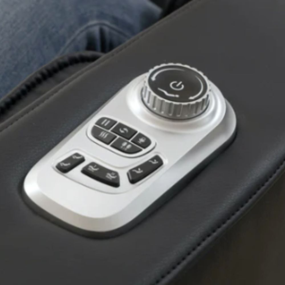 Control panel with buttons and a knob on a massage chair armrest
