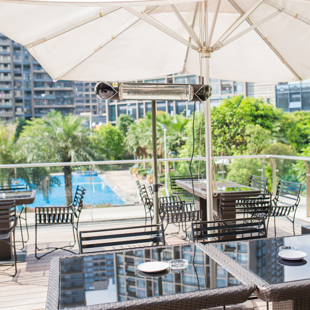 iQ Heat® Wave Space Heater on stand behind cafe tables