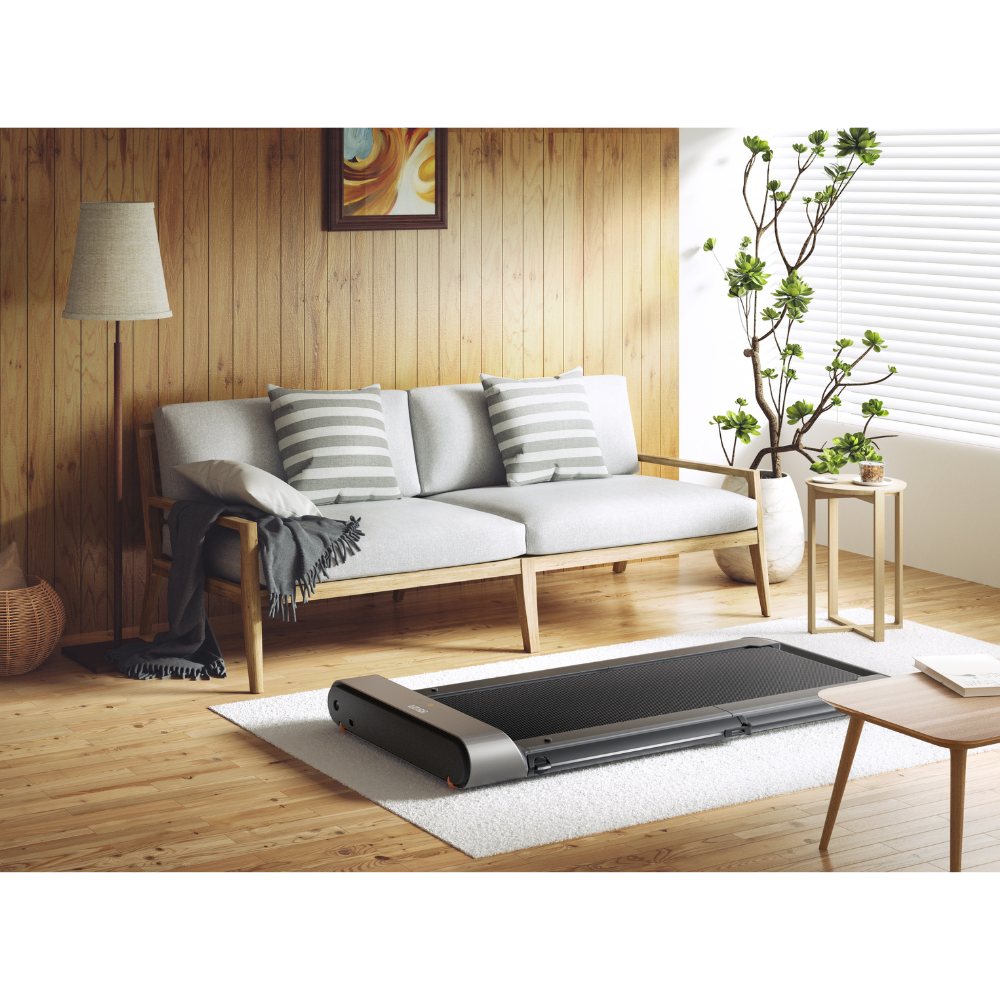 iQ Slim Tread® Foldable Treadmill in living room on rug