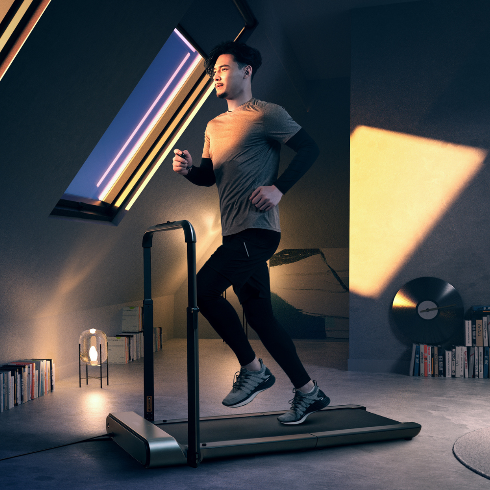 Man running on the iQ Slim Tread® Foldable Treadmill
