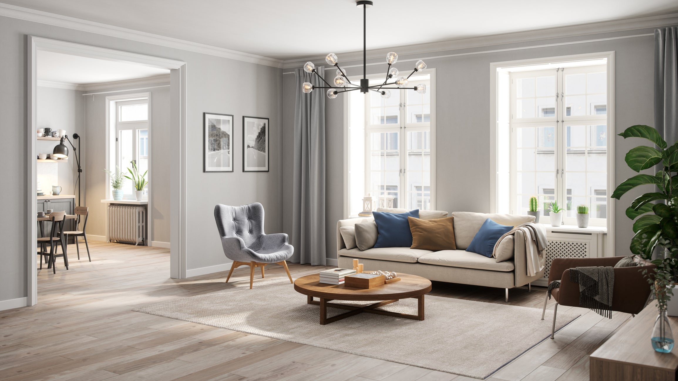 Photo of a light coloured living room with chairs, sofa and a coffee table. Kitchen and dining room are in the background.