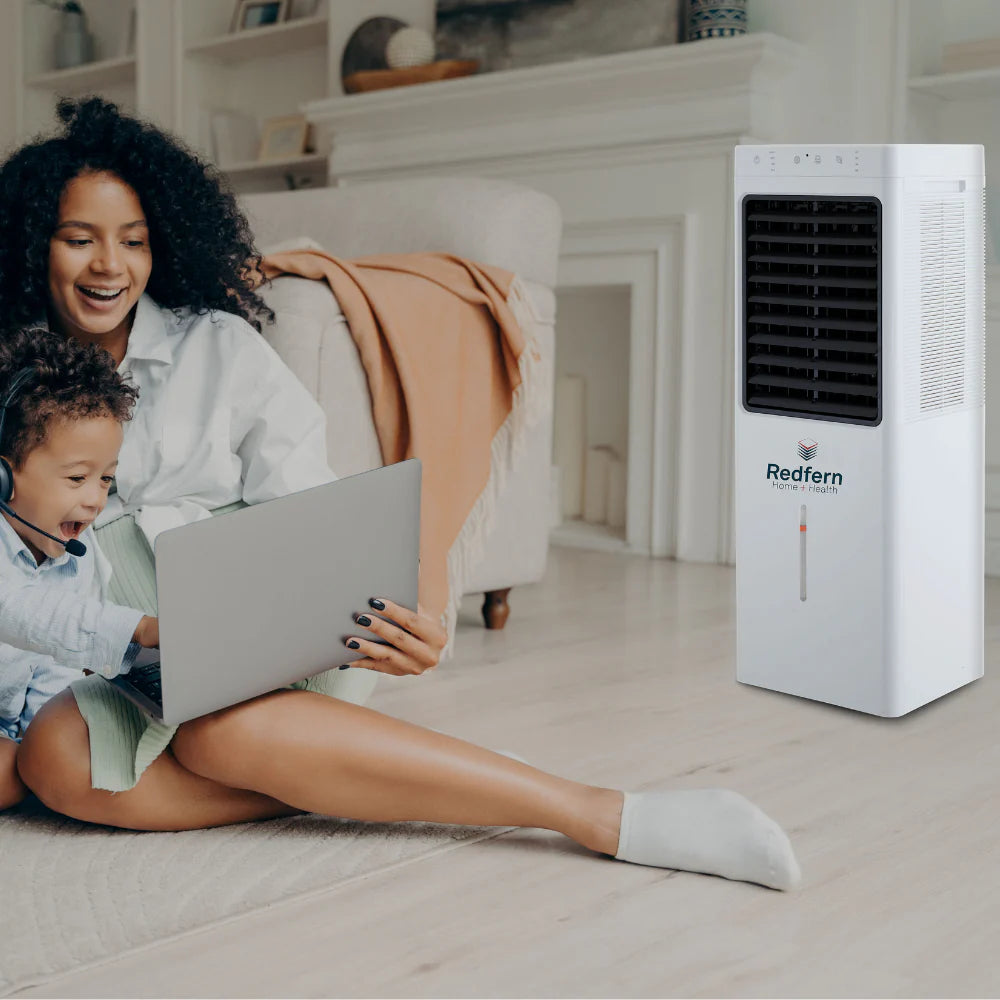iQ Pure Breeze 14EX being used by a Mother and Son in a living room