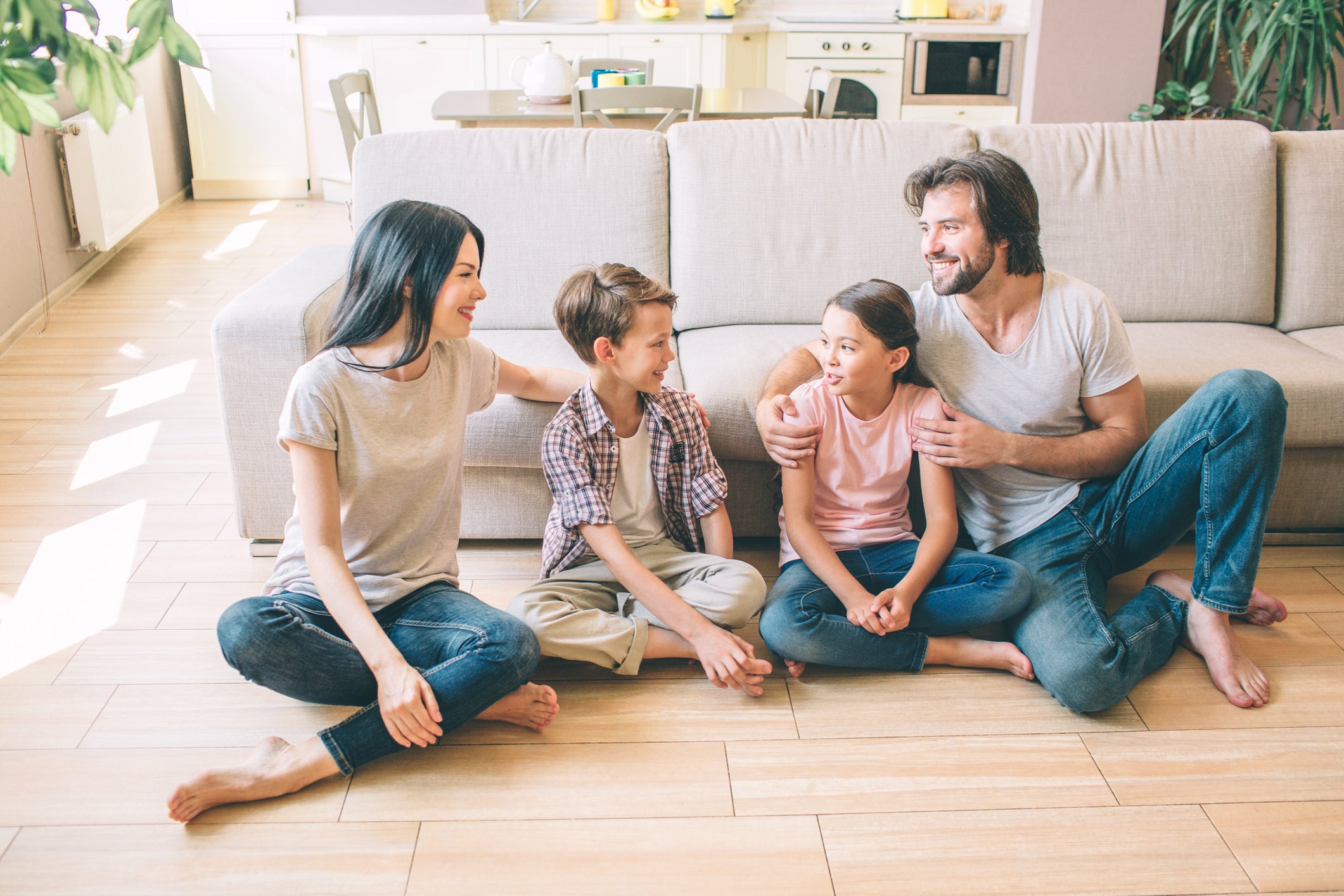 Family sitting on clean floor