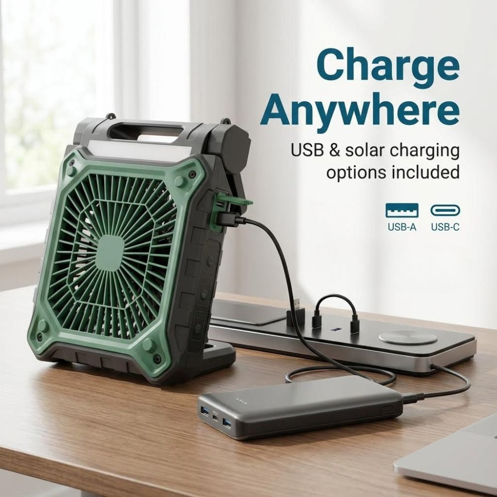 Portable solar fan with a charging device on a desk, featuring USB and solar charging options.