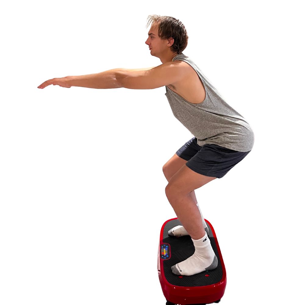 Person squatting while using a red vibration plate on a white background
