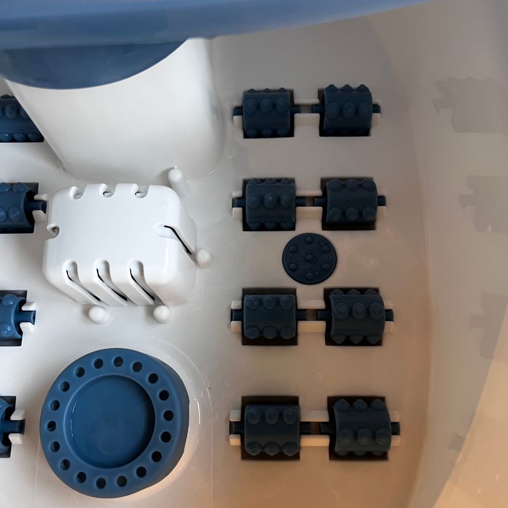 Close up of Foot Spa massager spinning wheels for massaging