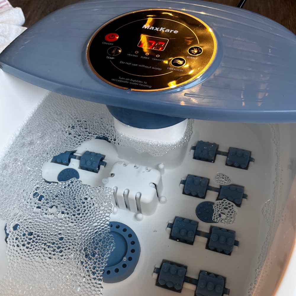 Foot Massage Spa with control panel, surrounded by bubbles.