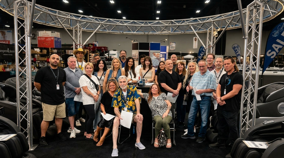 The Redfern team together at a massage-chair trade-show booth.