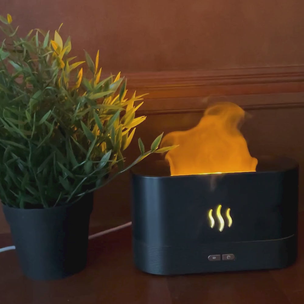 Video if the Aroma Flame Humidifier in use on a wood background